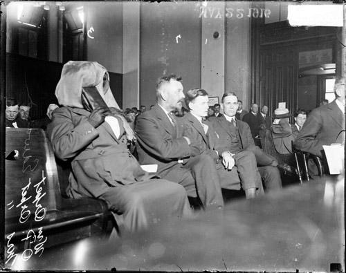 [William Orpet and his parents sitting in a courtroom relating to the Marion Lambert murder case in Waukegan, Illinois]